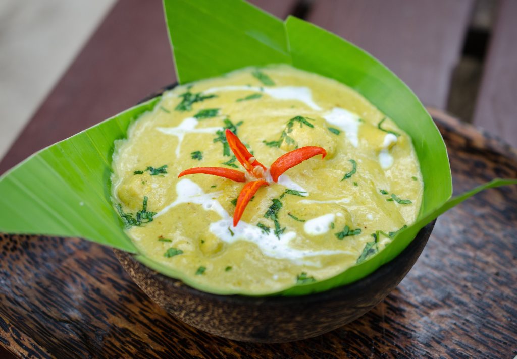 A bowl of amok trey, the national dish of Cambodia, made with fish, coconut milk, and kroeung spice paste, steamed in banana leaves. Cambodian cuisine: A bowl of amok trey, the national dish of Cambodia, made with fish, coconut milk, and kroeung spice paste, steamed in banana leaves.